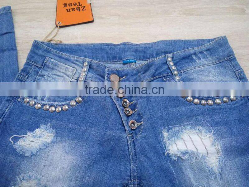 GZY cheap woman fashion Stocklots Women scratch jeans factory