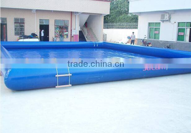 inflatable swimming pool floating on water deployed