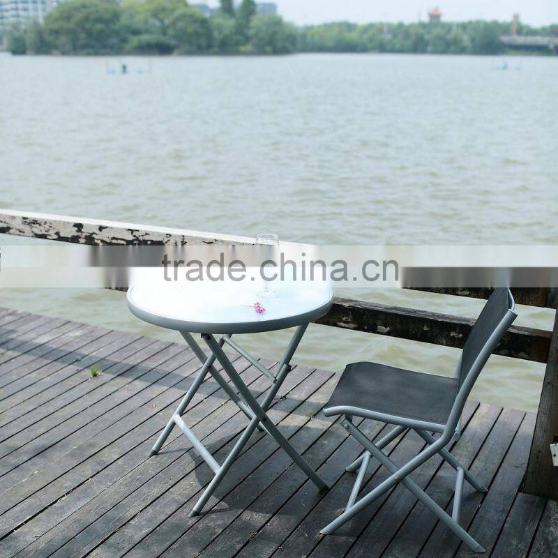 Metal folding table with silk screen printed stalinite top