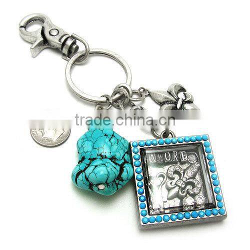 Brown cross keyring accented by spur fashion cross keychain