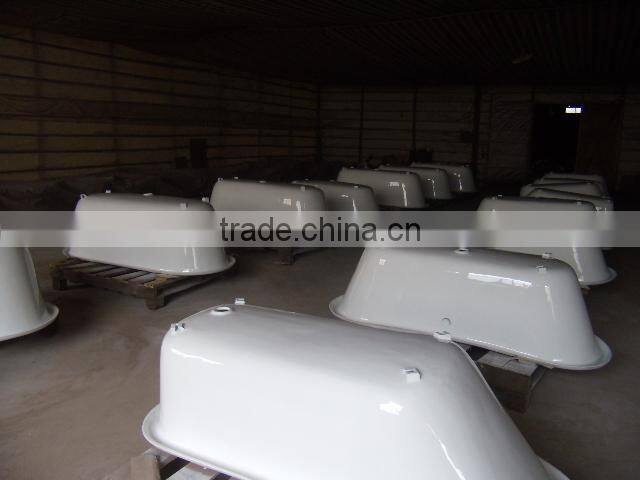 rectangular freestanding cast iron bathtub with wooden cradle