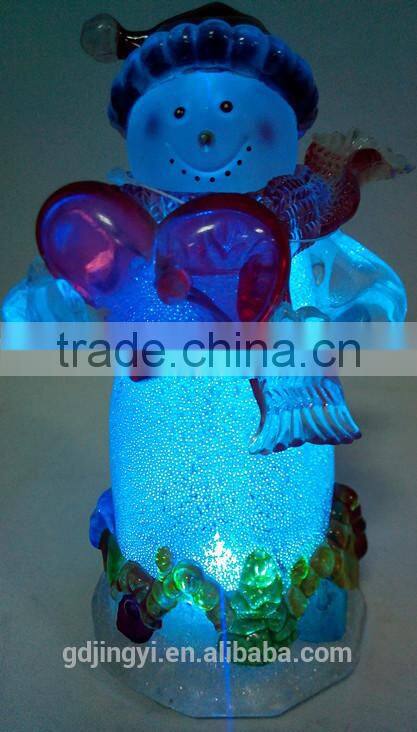Holding a red heart acrylic snowman with LED Light