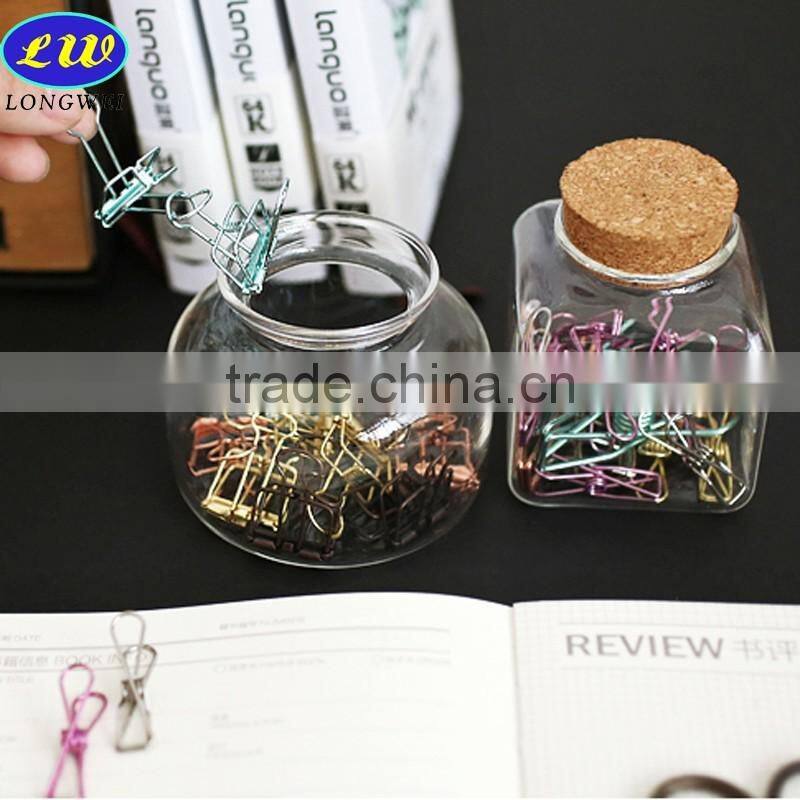 round and square glass bottle with wooden lid