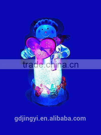 Holding a red heart acrylic snowman with LED Light