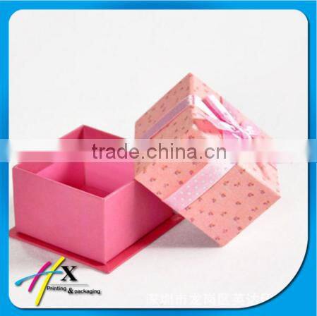 Bright yellow small plastic watch box with pillow