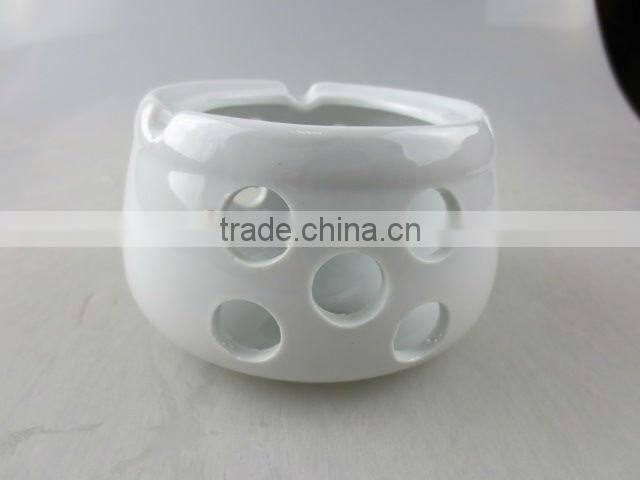 white round porcelain ashtray with holes