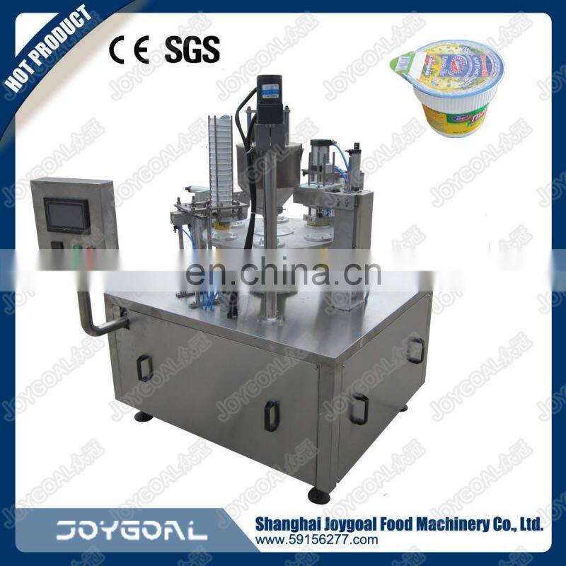 used wildly rotary table juice cup filling and sealing machine