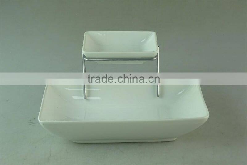 stocked white ceramic rectangle French fries serving plate with dipping dish and iron stand