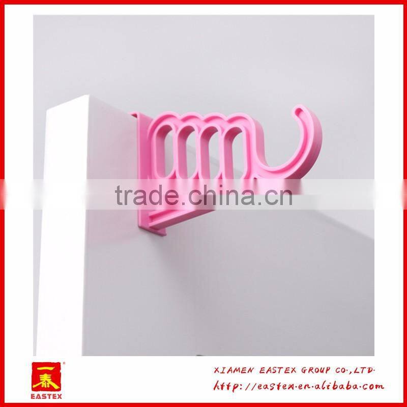 Multipurposed pothook behind the door