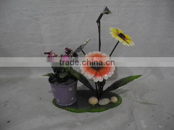 Colorful metal flowers planter with bicycle