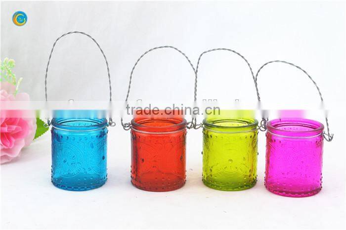 decorative wall hanging jar candle holder with black metal wiring cross pattern