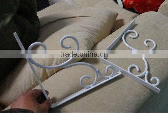 A Pair of Vintage Wrought Iron Architectural Wall Hanging Basket Brackets