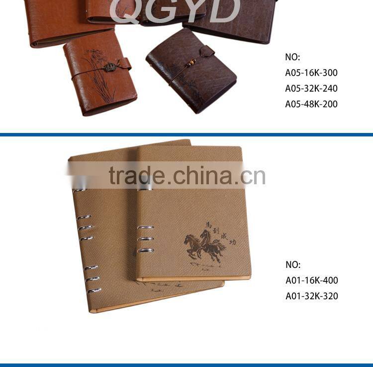 brown color notebook with metal nameplate elastic bind