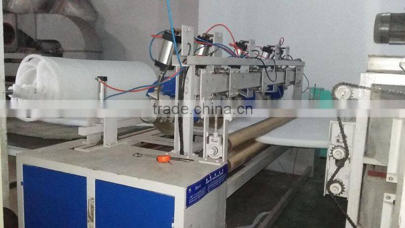Nonwoven waddings edge cutting and rolling machine , trimming and coiling machine
