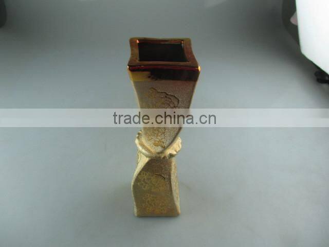 beautiul golden porcelain type vase with flower design