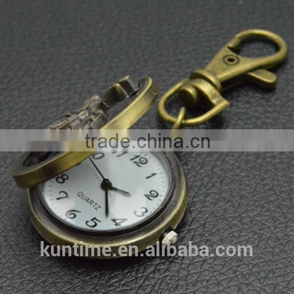 Bronze vintage watch with keychain decorate with motorbike