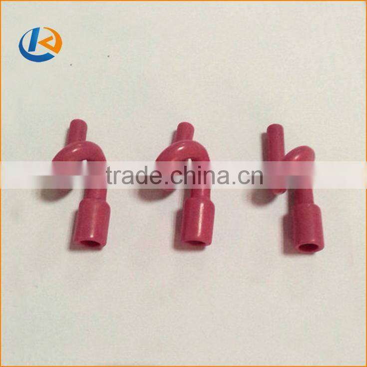 Slotted textile ceramic eyelet for wire guiding