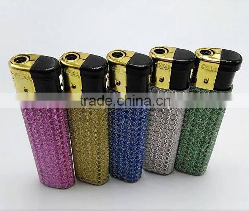 Silver match lighters colored with golden cap star lighter