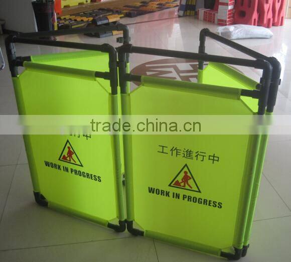 green fabric folding traffic fence