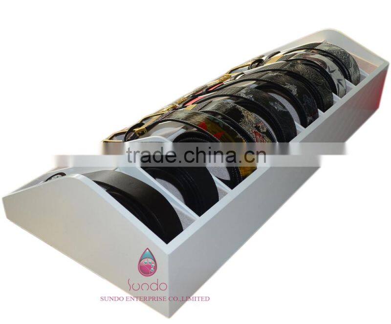 custom white lacquered wood belt display