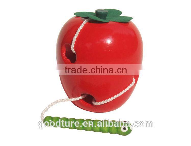 Wooden Caterpillar Eating Red Apple