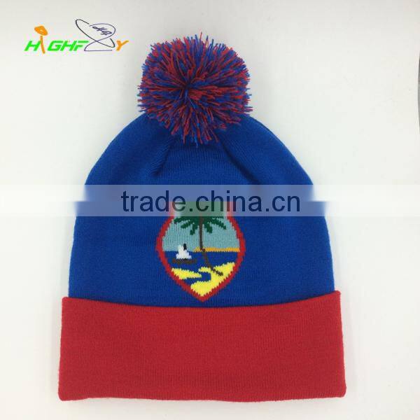 high quality brand OEM blue and green jacquard logo pom pom knit slouchy beanie hat with top ball