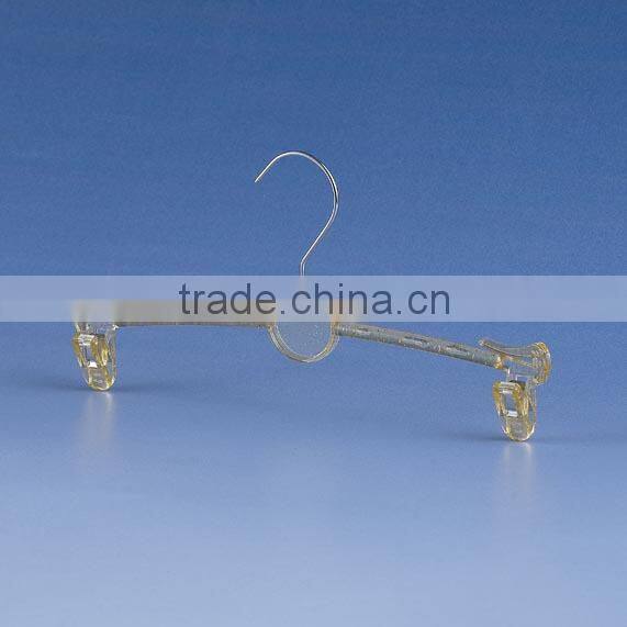 Gold metal hanger with clips for bikini clothes
