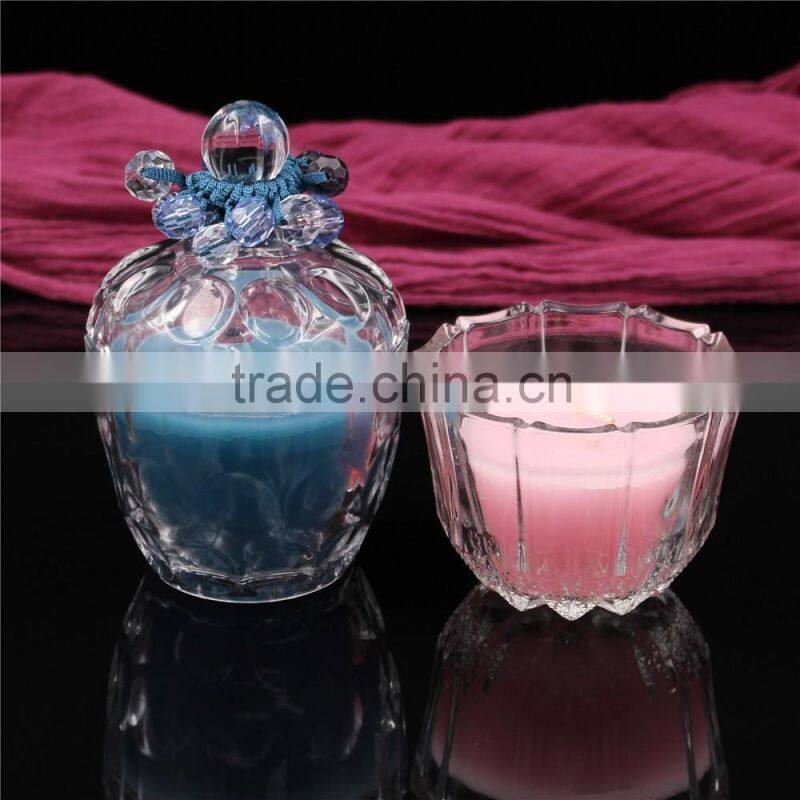 christmas colorful soy or paraffin wax scented candles in glass jars