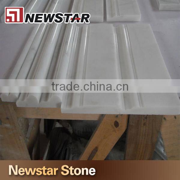 Polished white marble chair rail, marble mouldings, marble trim