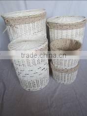 white color willow material round brown basket of dirty laundry