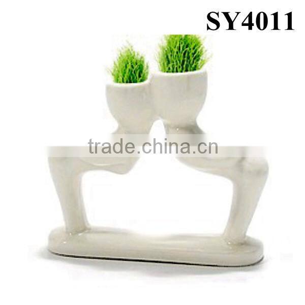 Energy little white man growing grass doll