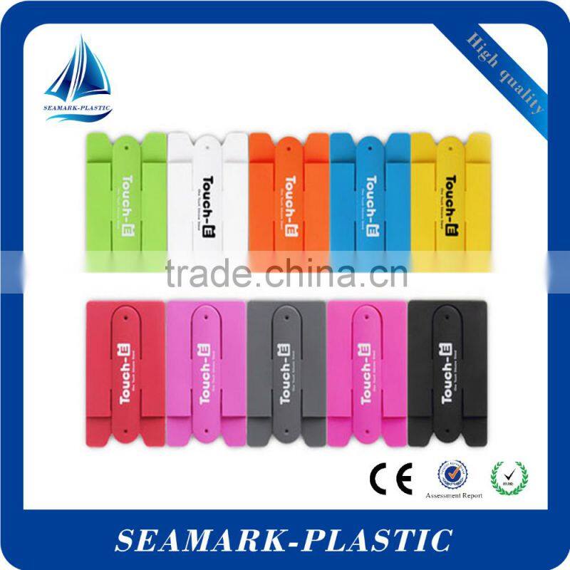 2016 cheap promotional touch u silicone stand up card holder for mobile phone