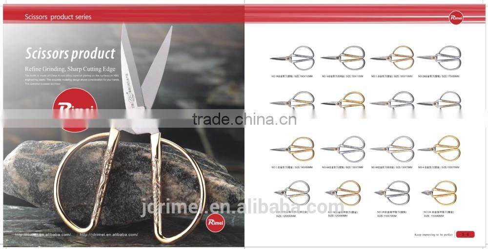 red hand tool engraved scissors