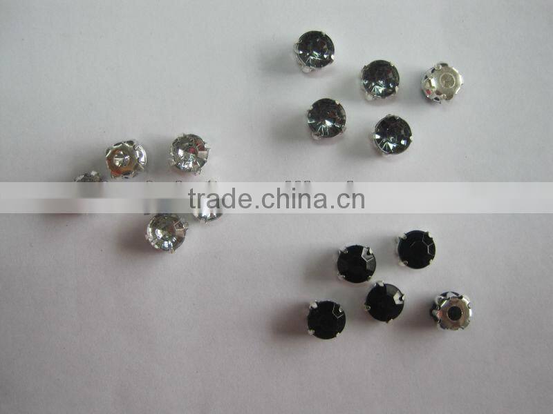 rhinestones in silver claw setting with two prongs