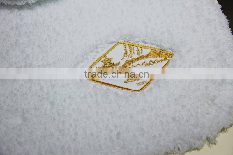 cotton bath rug hand tuffted with embroidered logo