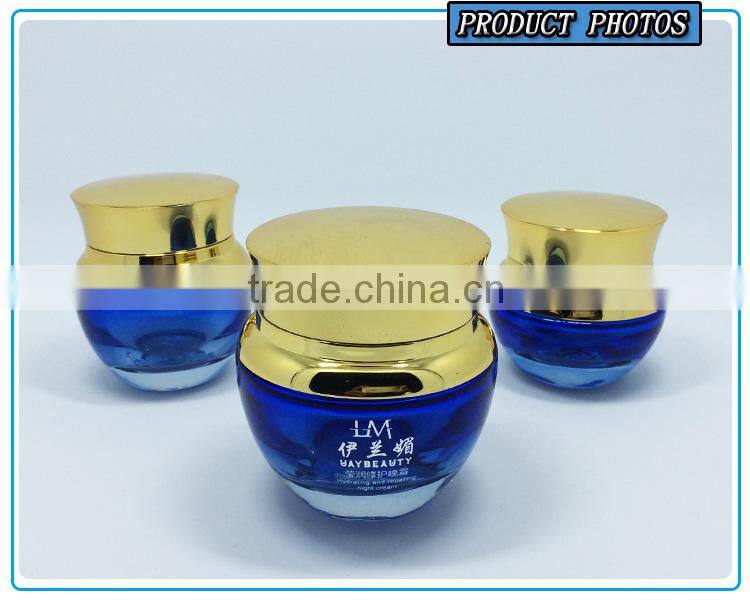 Bule colored glass cosmetic serum bottle and glass cosmetic cream jar with gold pump lid