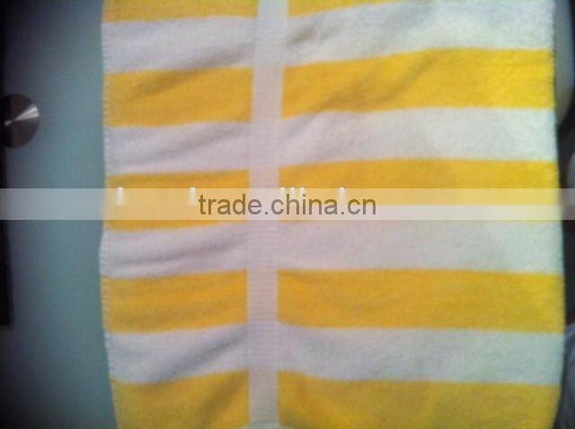 Yellow and white hotel pool towel, beach towel