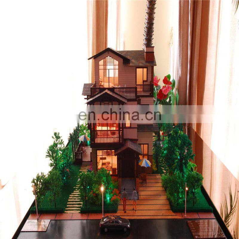 Small house model with warm light effect, architectural maquette