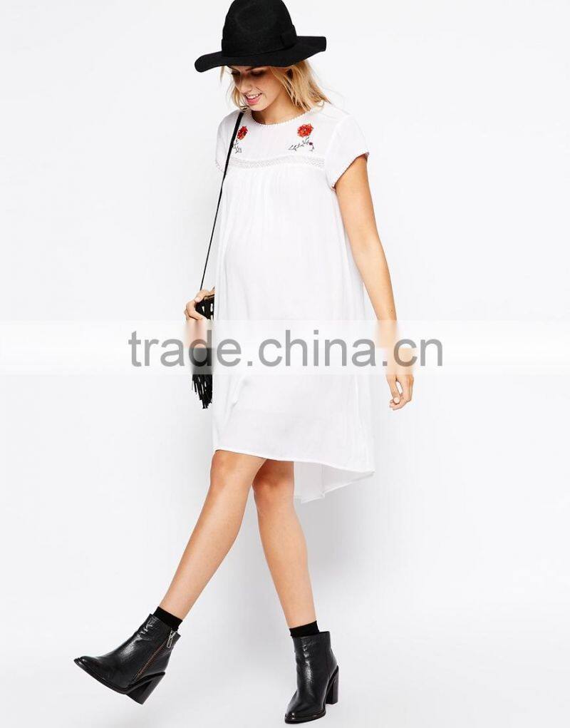 Maternity Embroidered Swing Dress With Dipped Hem China supplier