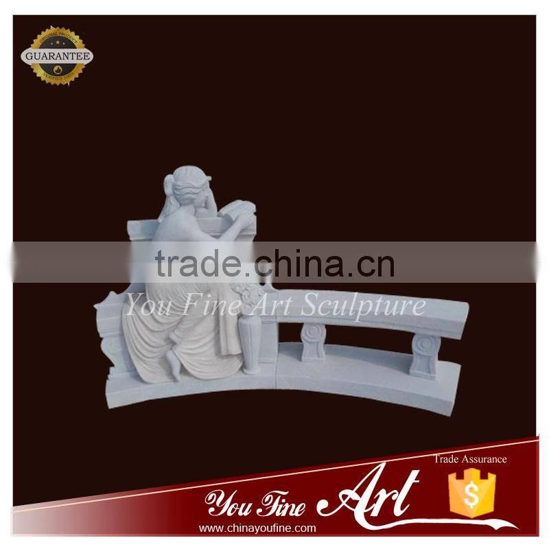 decorated stone garden bench with figure