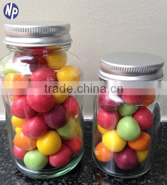 clear glass candy bottle with metal cover