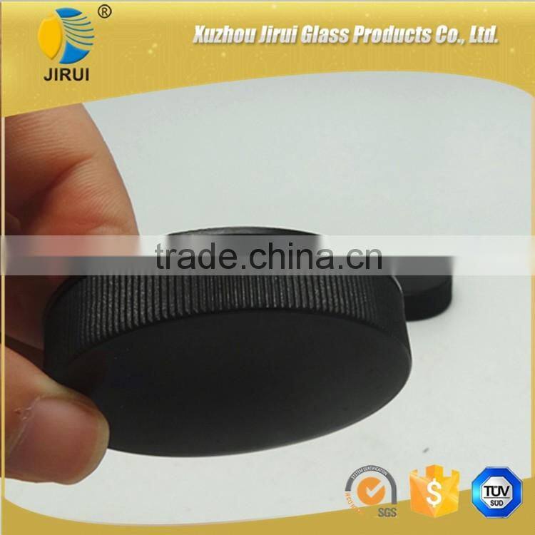 Amber vitamin pill glass bottle with lined black closure