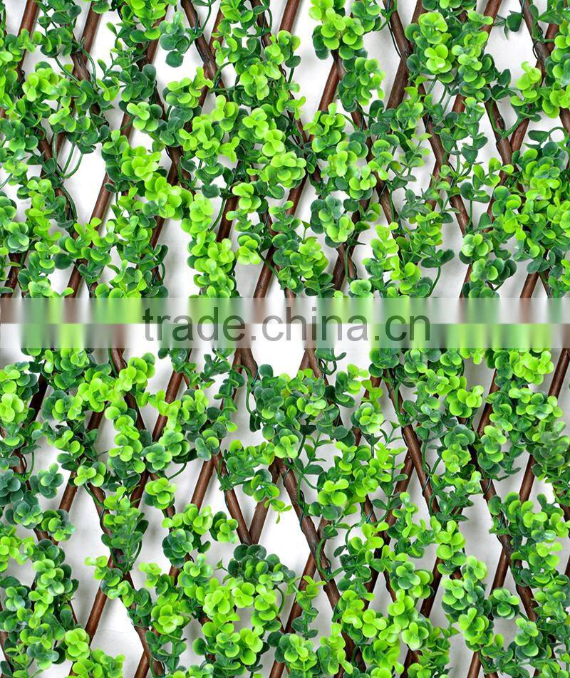 Garden trellis decorated with artificial plants