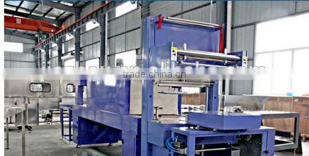 Automatic hot shrink film wrapping packing machine