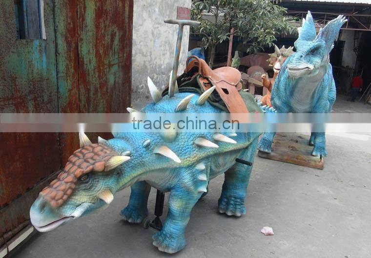 Amusement park facility riding and roaring dinosaur