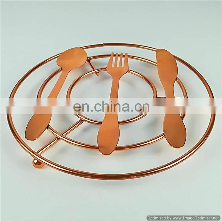 silver flower design trivet