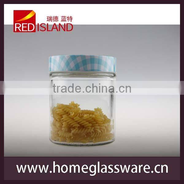 Hand decorated glass storage jar with design metal lid