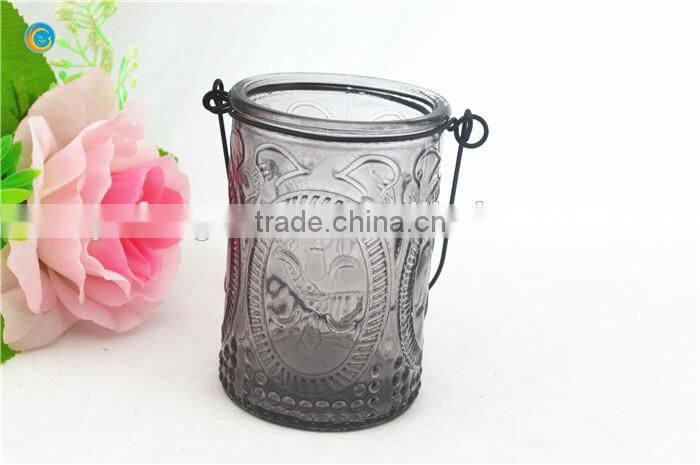 decorative wall hanging jar candle holder with black metal wiring cross pattern