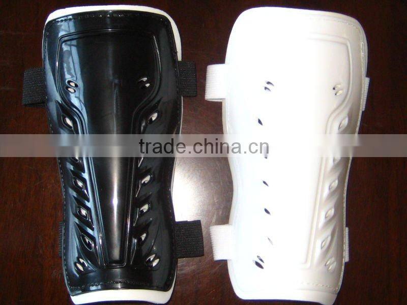 Soccer shin guard with instep