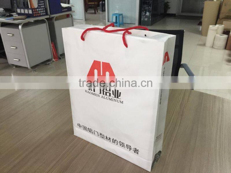 Custom design paper bag with different handle types of kraft thread paper